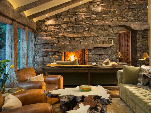 Earthen tones and ochre stones frame the fire