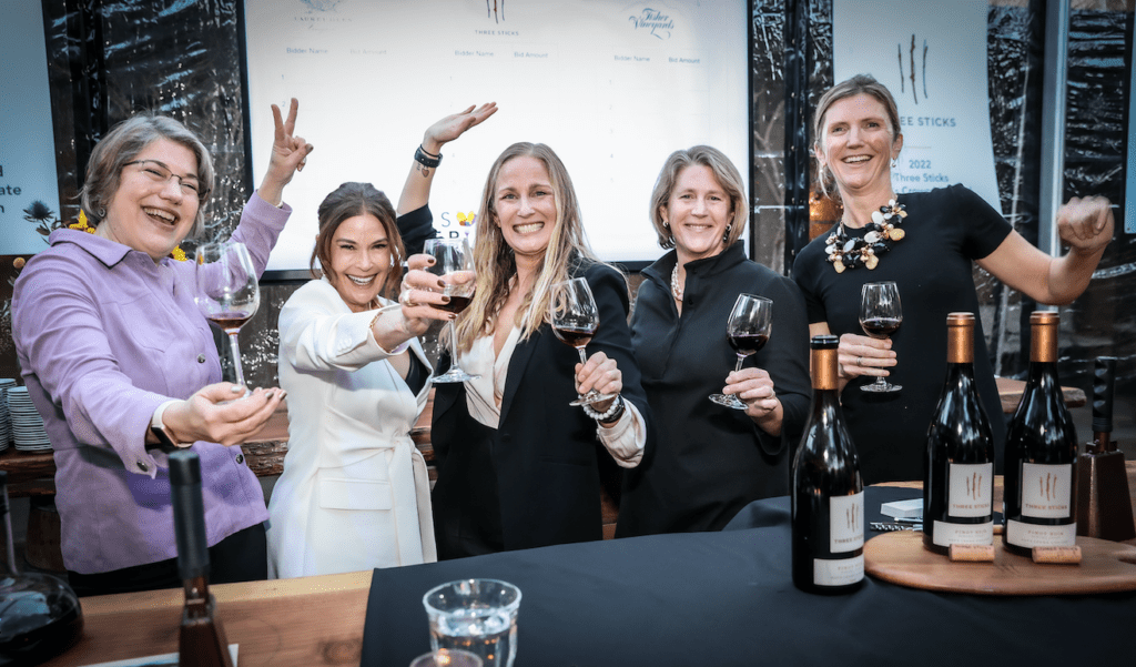 Bettina Sichel of Laurel Glen Vineyard, Actor Teri Hatcher, Prema Kerollis Behan of Three Sticks Wines, and Whitney Fisher and Cameron Fisher of Fisher Vineyards kick off the Barrel Auction at the Epic Party at Mayacama.