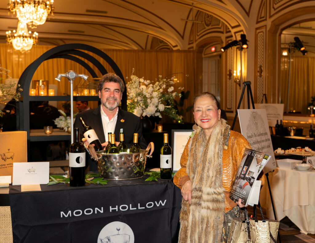 Olivia Decker with Xochi Birth's Moon Hollow Winery stand