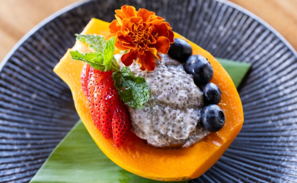 Sunrise Papaya with chia seed pudding and fresh fruit.