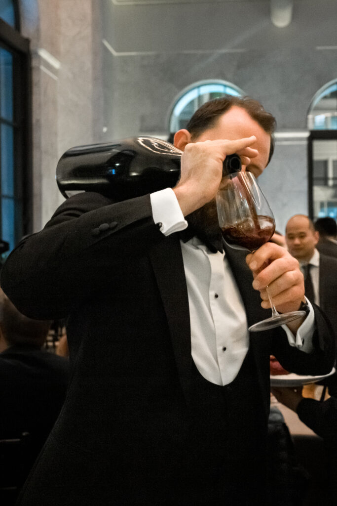 A Sommelier tactically pouring a Jeroboam, which holds 3 litres of wine.