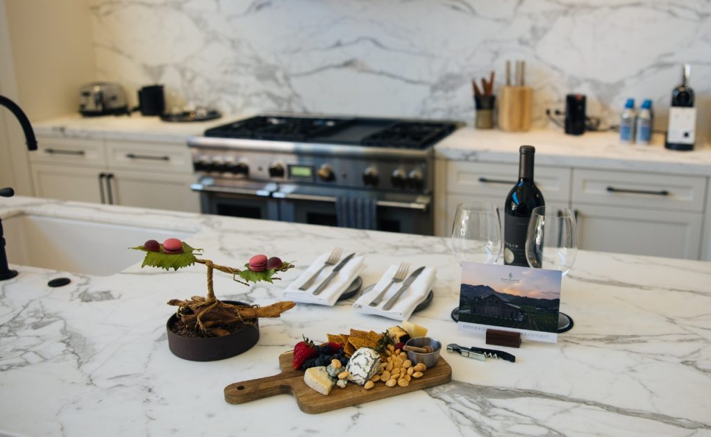 Four Seasons Napa Valley wine and cheese board on kitchen counter in villa.