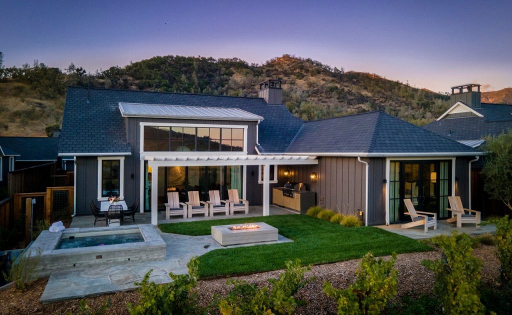 Spacious patio area with hot tub, fireplace and ample seating areas at Four Seasons Napa Valley Private Residence.