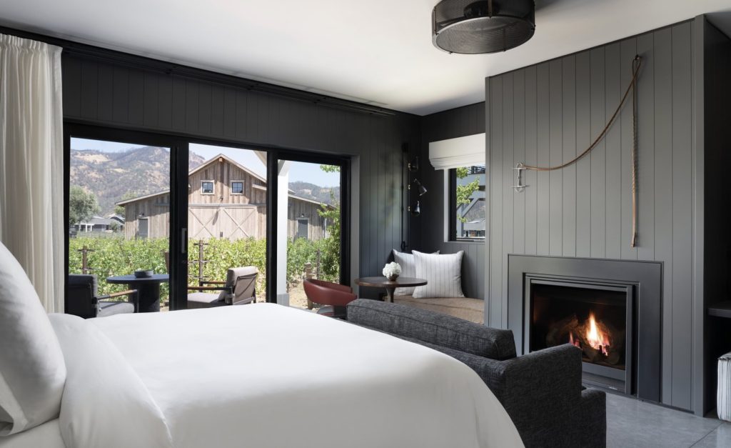 Fireplace, vineyard views, soaking tub, and a wine fridge at Four Seasons Napa Valley villa.