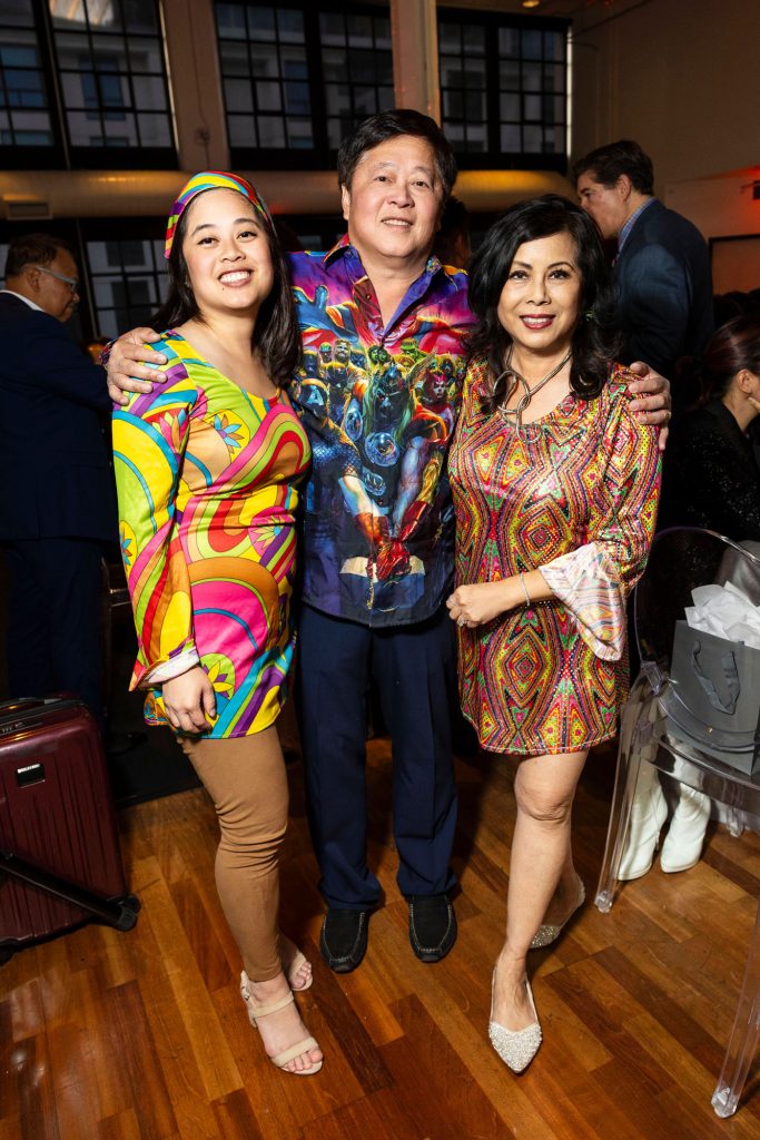 **ALT text:**
Guests in vibrant outfits at Dress for Success SF gala.