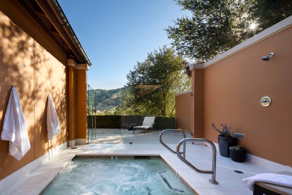 Private outdoor hot tub at CordeValle with mountain views, offering a tranquil luxury wellness experience.