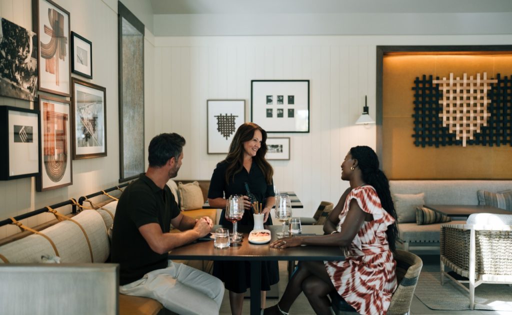 Guests tasting wine at Elusa winery at Four Seasons Resort and Residences Napa Valley.