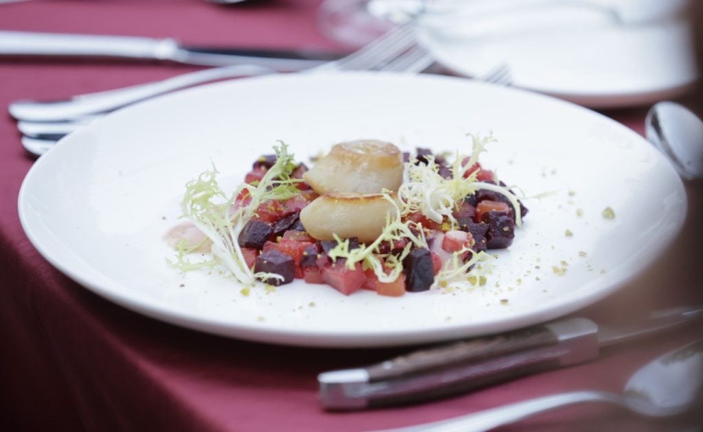 Chef Angelo Auriana’s first course “Barbabietole, Capesante, Pistacchi” featured a mosaic of late summer marinated garden beets, Hokkaido sea scallops, strawberry dressing, and pistachio powder.