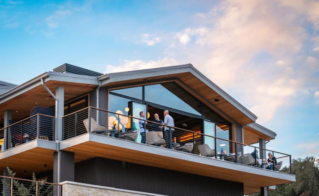 Guests chatting at Andys Beeline Rooftop overlooking the Appellation Healdsburg grand opening event.
