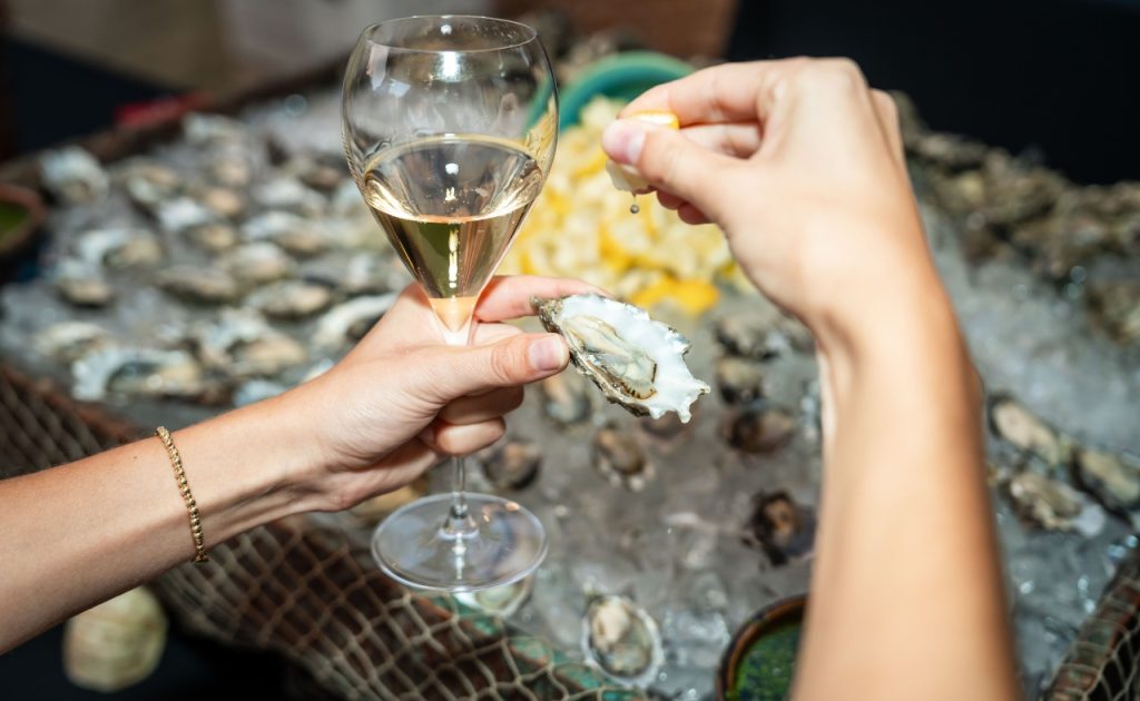 Hog Island Oysters and Charlie Palmer Cuvee champagne served at the Appellation Healdsburg grand opening.